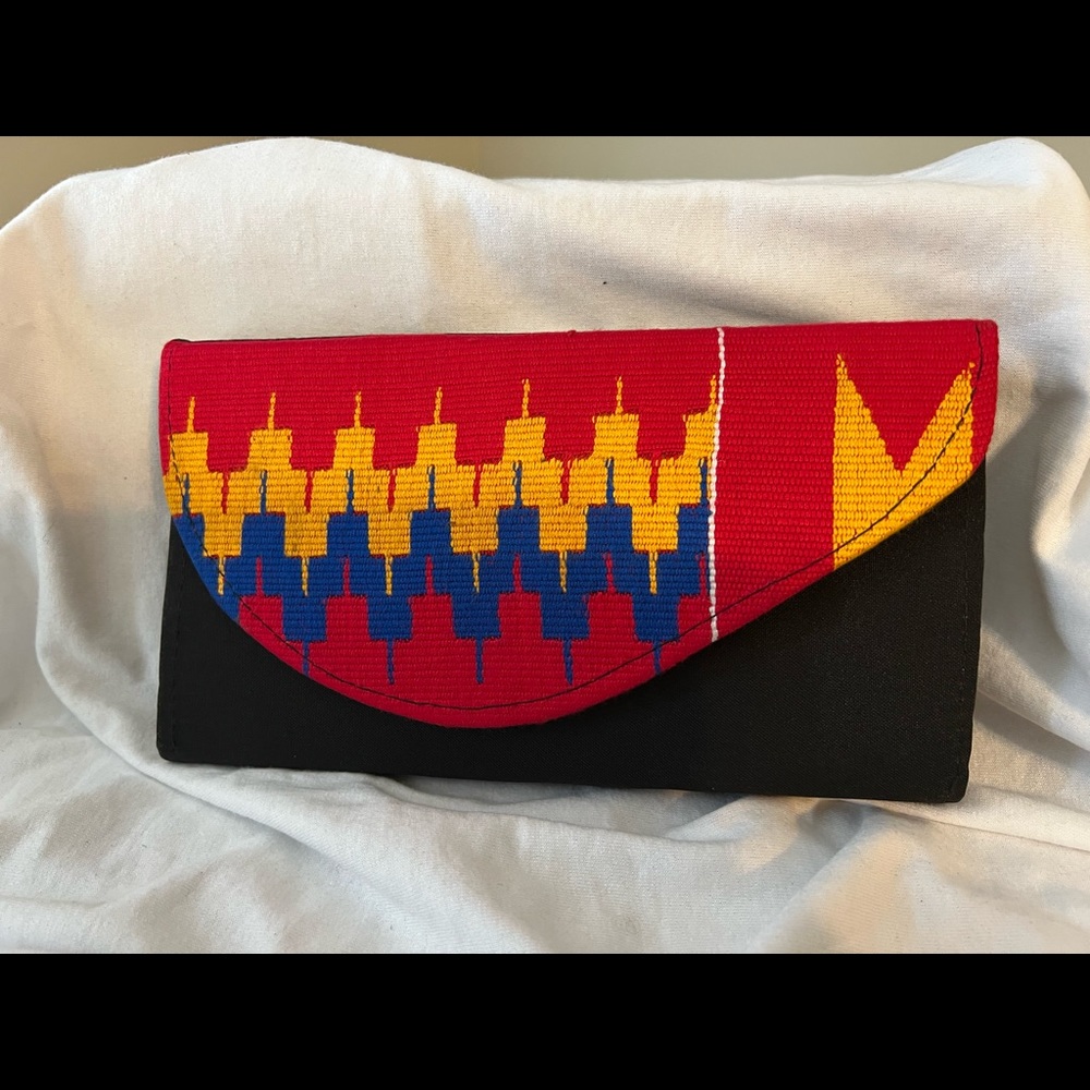 Clutch handmade in Ghana, West Africa accented with Kente cloth